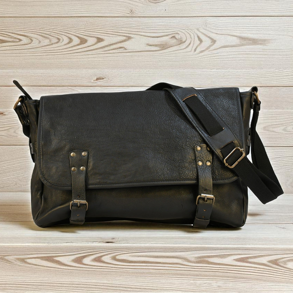 Bovine Leather "Courier" Messenger Bag - Black on a wooden surface