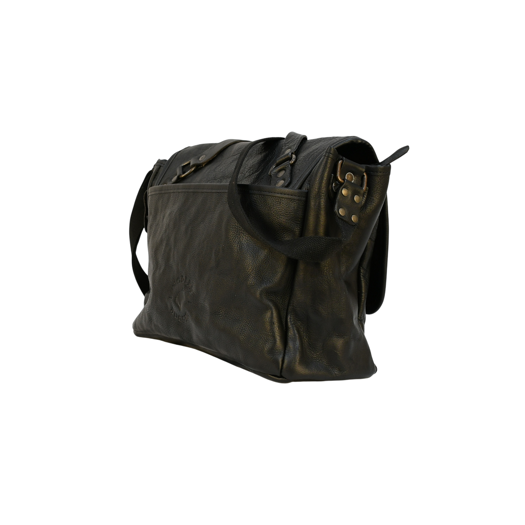 Black modern rugged leather bag with a black strap on a stone pavement street.