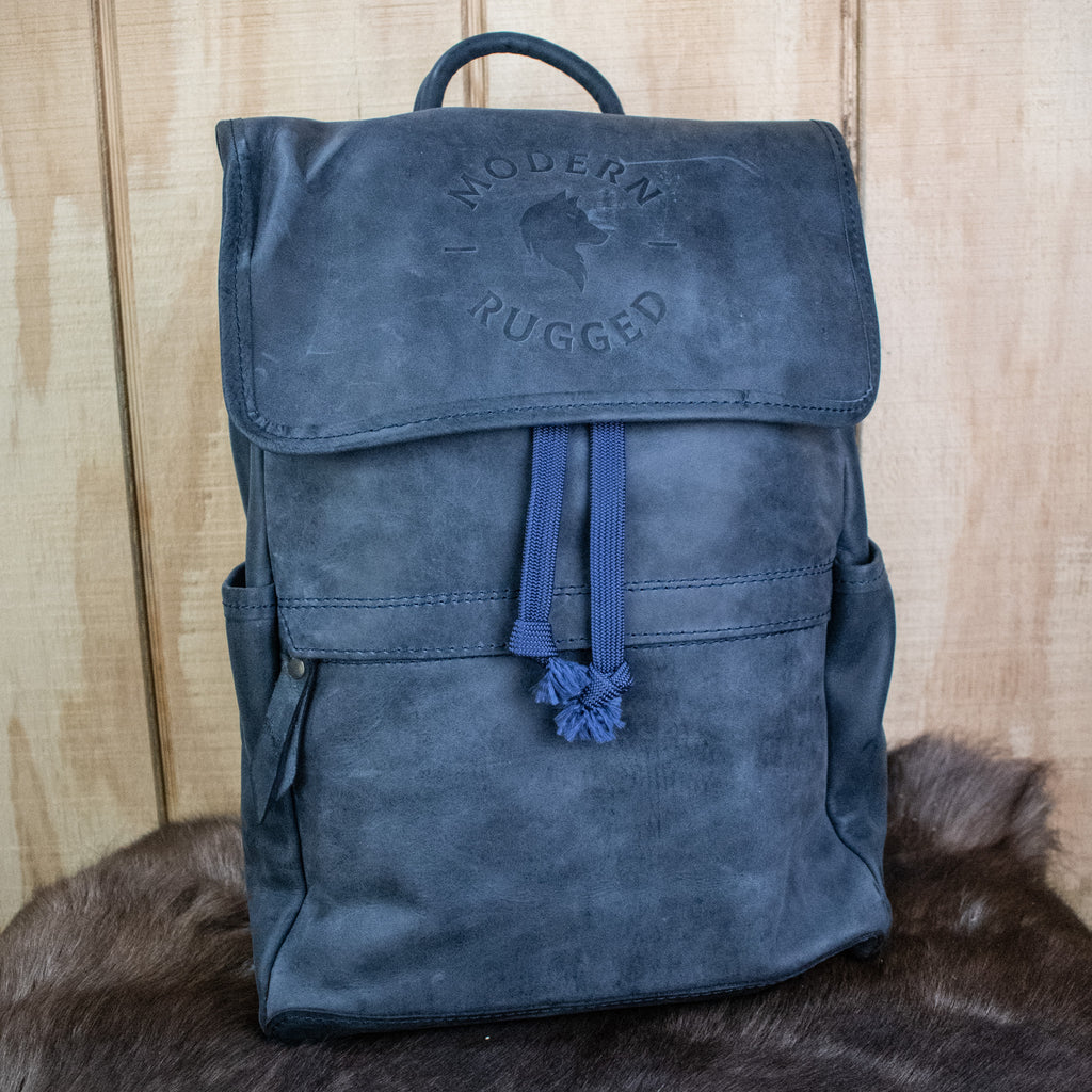 Leather Hide Backpack in Soft Navy (Weathered) with Modern Rugged Logo and lifetime warranty