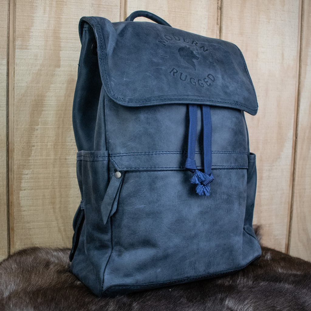 Leather Hide Backpack in Soft Navy (Weathered) with Modern Rugged Logo and lifetime warranty