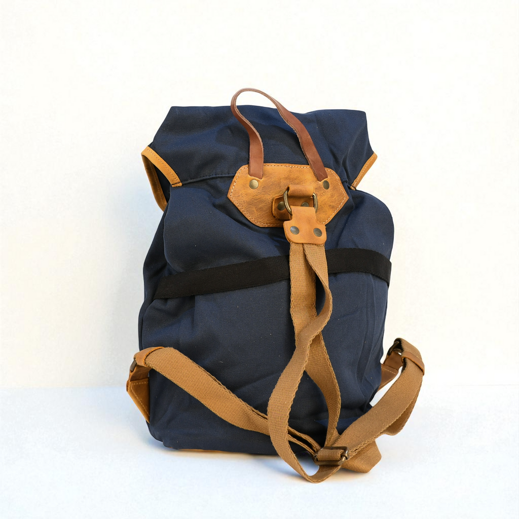 Blue backpack with brown straps on a white background